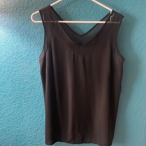 Beautiful black shell with sheer detail at v-neck and arms.
